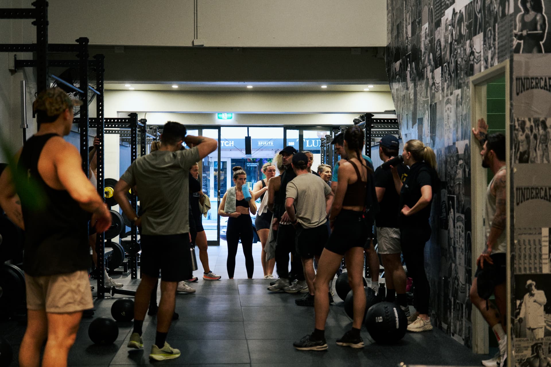 A busy coached class between the rigs in the full studio at Undercard Strength, Paddington